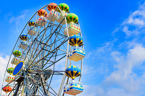 Ferris Wheel Ferris wheel on the background of blue sky with cloud ferris wheel photos stock pictures, royalty-free photos & images