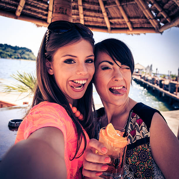 istock friends at beach club, taking selfie 517726935