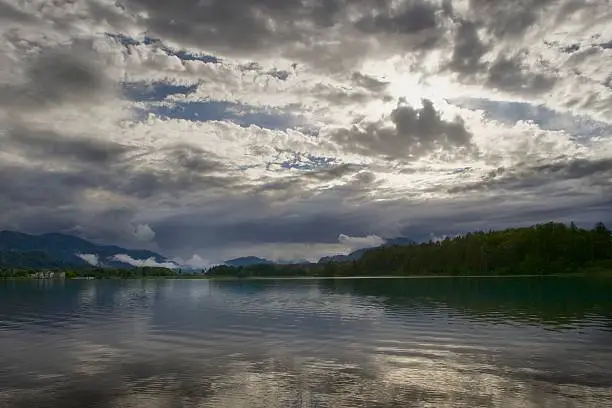 clouds after shower at faaker see in austria