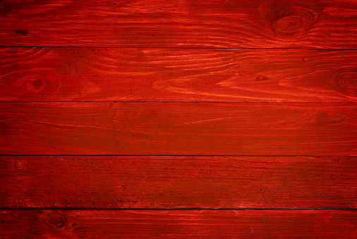 Red painted old wooden wall - background or texture