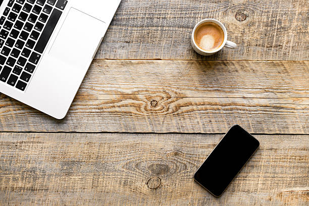 istock Comfortable working place at wooden table with laptop and coffee 517738140