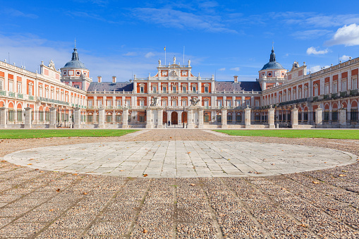 Aranjuez, Spain - November 8, 2014: Main court of Royal Palace of Aranjuez. It is a residence of the King of Spain open to the public. Visible unrecognizable people in the court