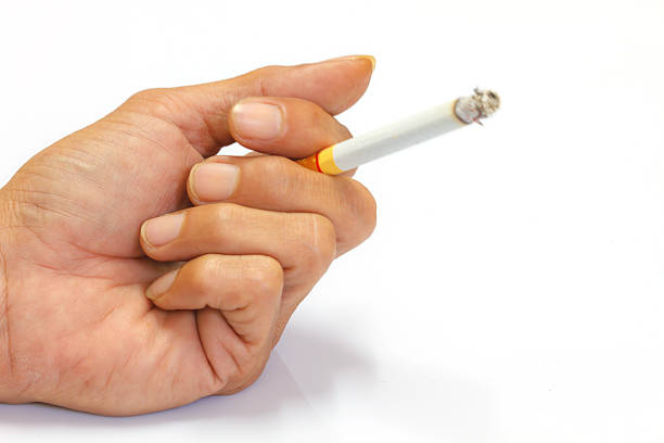 istock Cigarette in hand of men 517738584