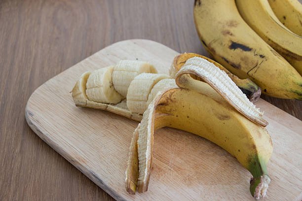 istock banana over a table, close-up,depth of field. 517741506