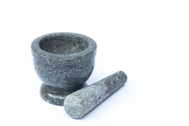 istock Stone mortar and pestle on white background 517741666