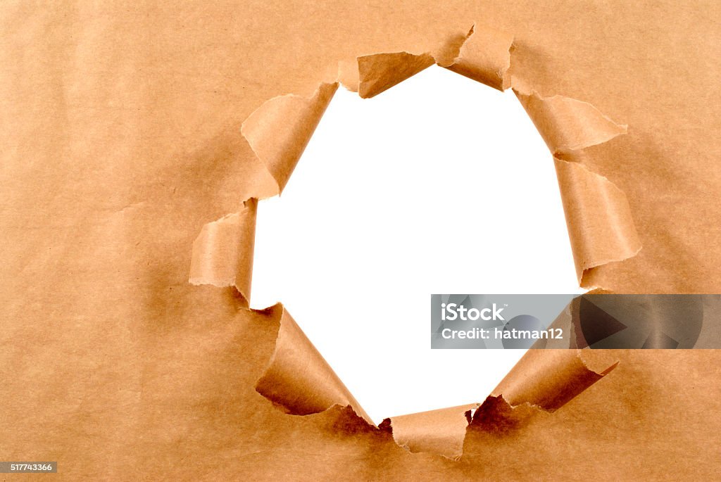 Brown Craft Paper Background With Untidy Torn Hole Stock Photo