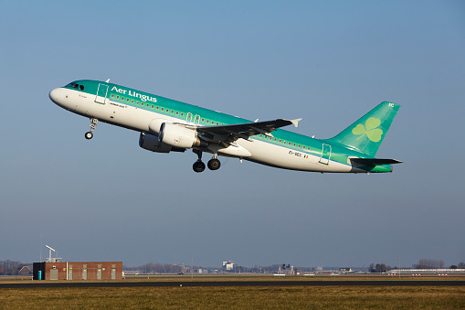 Amsterdam, The Netherlands - March 13, 2016: The Aer Lingus Airbus A320-214 with identification EI-DEC takes off at Amsterdam Airport Schiphol (The Netherlands, AMS), Polderbaan on March 13, 2016.