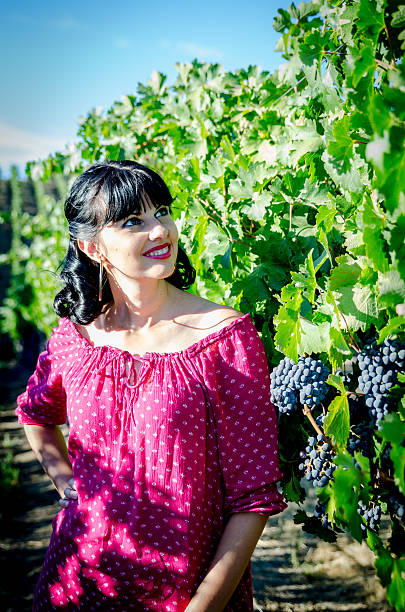 istock Playfull brunette in the vineyard 517744557