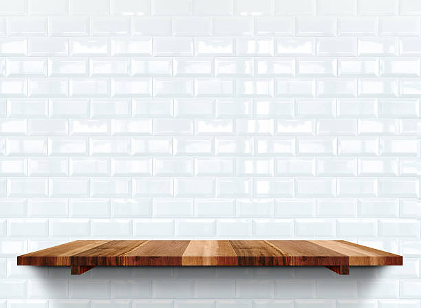 istock Empty wooden shelfs on white glossy tile wall, 517744570