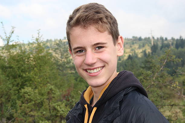 istock teen boy on natural background 517744779