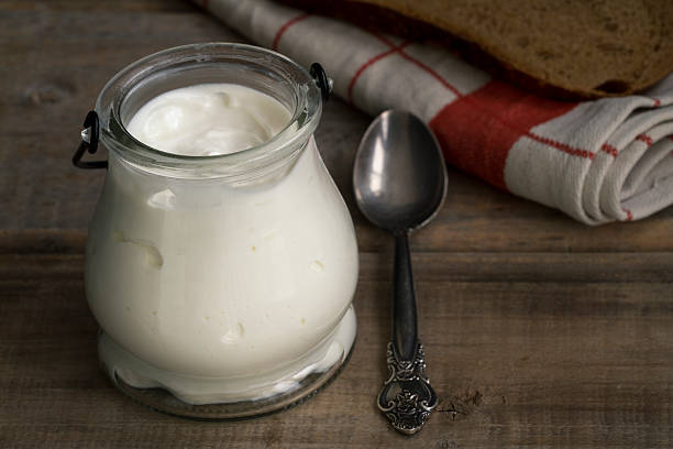 istock Greek Yogurt on a vintage wood background 517744888