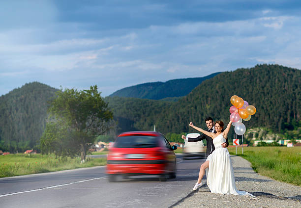 istock hitchhiking grooms 517746267