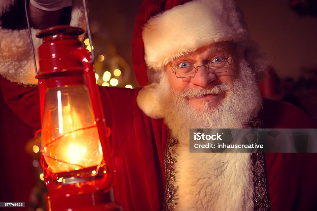 Real Santa Claus carrying lantern Real Santa Claus carrying lantern  60-69 Years Stock Photo