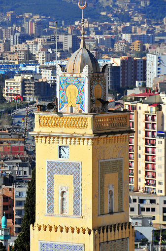 Béjaïa / Bougie, Kabylia, Algeria: minaret of the Sidi Soufi mosque with its beautiful art deco tiles - built by the French - the lower city can be seen in the background 