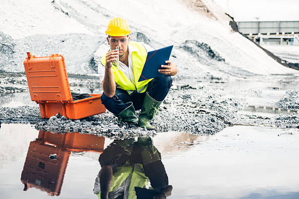 istock industrial worker checking quality of iron ore 517746831