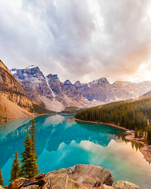 Moraine Lake, Banff National Park A beautiful and unique image of Moraine Lake in Banff National Park, Alberta, Canada, during sunset. An HDR treatment was used to captured all the dramatic colours and tonal depth.  moraine lake stock pictures, royalty-free photos & images