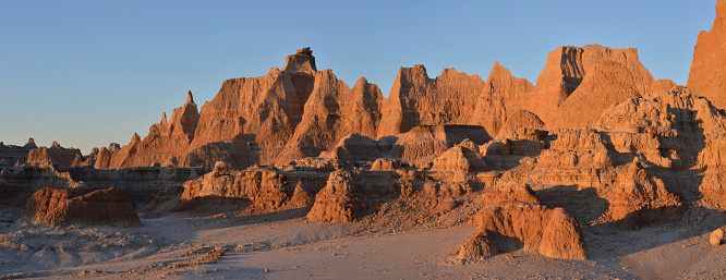 Large panorama of moonscape rock formation at Badlands National Park, South Dakota, USA. Picture taken at Sunrise near viewpoint called Windows.
