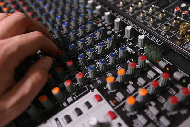 istock TV editor working with video and audio mixer 517747992