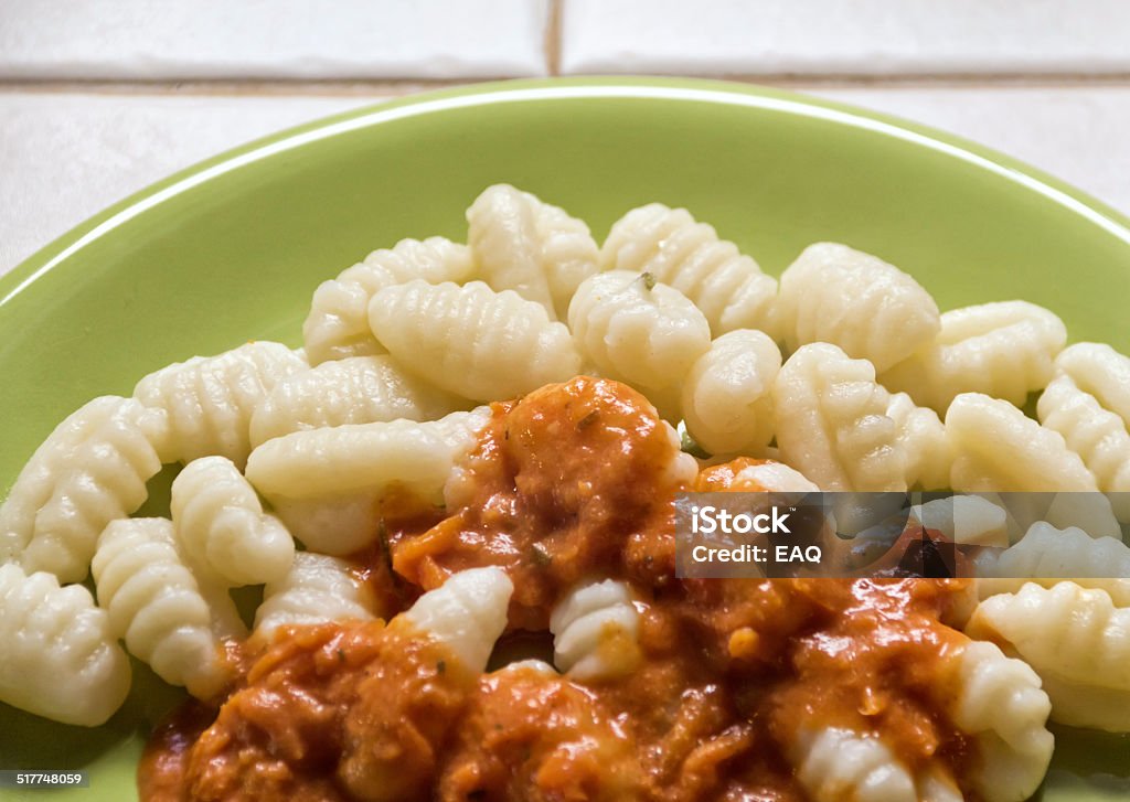 Italian gnocchi Italian gnocchi with sauce of tomato and milk cream. Argentina Stock Photo