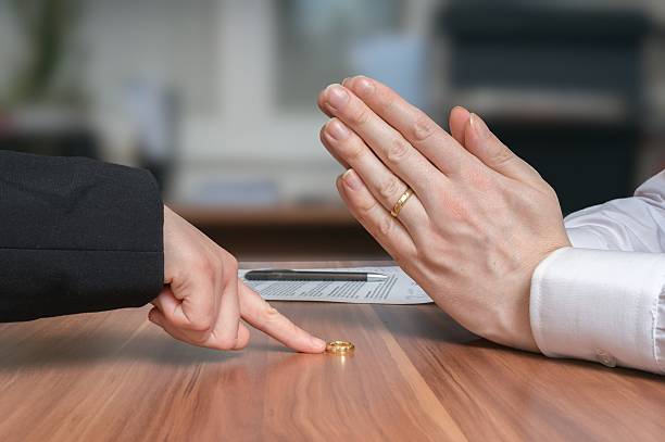 istock Divorce concept. Wife is returning ring to her disappointed husband 517748448