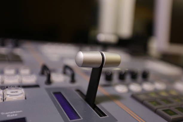 istock TV editor working with video and audio mixer 517748484