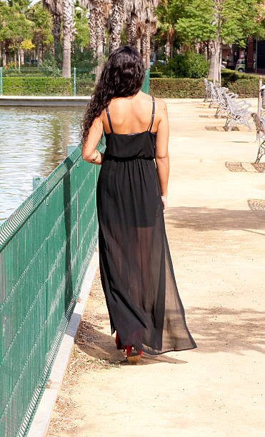 istock Beautiful woman from behind in a park 517748505