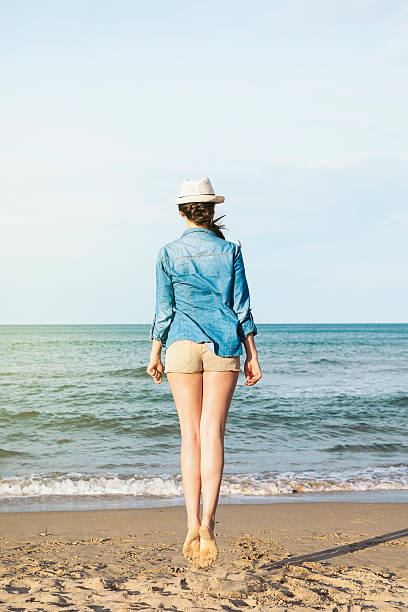 istock Woman jumping on the beach. 517751580