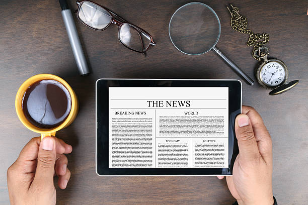 istock Man reading news on digital tablet 517751880