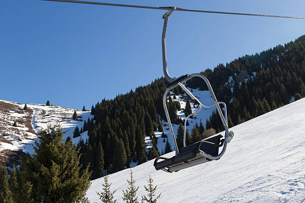 istock chair lift in the mountains 517751934