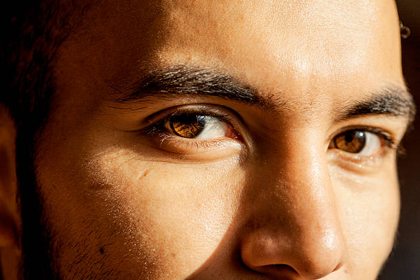 istock Man's brown eyes looking into the camera 517752320