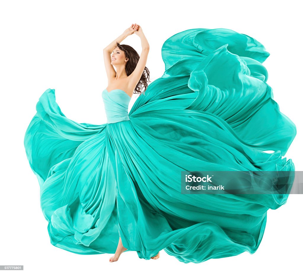 Woman Dancing In Fashion Dress, Fabric Cloth Waving On Wind Woman Dancing In Fashion Dress, Fabric Cloth Waving On Wind, Flying Girl In Fluttering Gown And Flowing In Motion. Isolated Over White Background Evening Gown Stock Photo