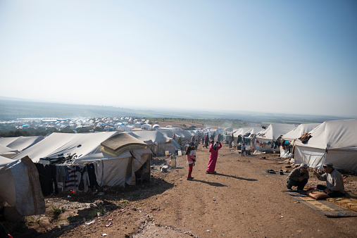 Atmeh, Syria - January 14, 2013: Internally displaced Syrians at a refugee camp near the Turkish border in Atmeh, Syria