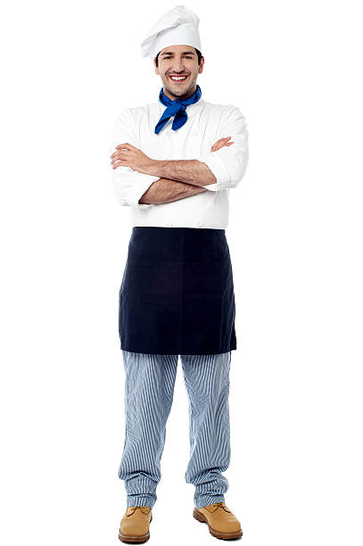 istock Smiling young male chef with arms crossed 517779763