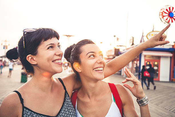 istock Two friends at amusement park 517780539