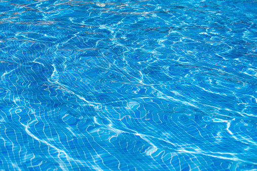 Abstract view of the water surface of a big swimming pool