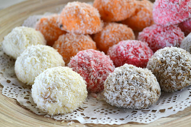 istock Orange, white and pink coconut candies 517782167