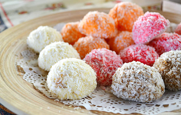 istock Orange, white and pink coconut candies 517782179