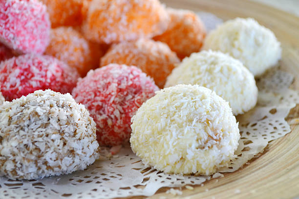 istock Orange, white and pink coconut candies 517782189