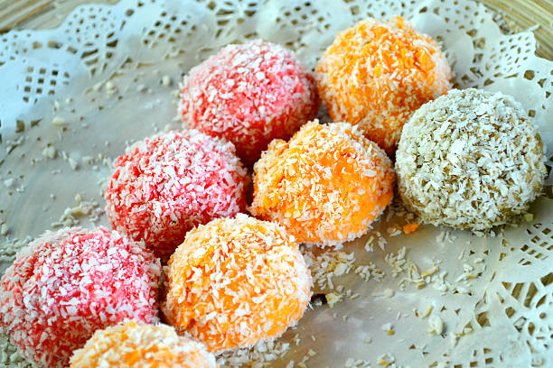 istock Orange, white and pink coconut candies 517782209