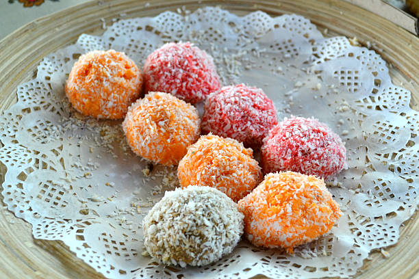 istock Orange, white and pink coconut candies 517782221