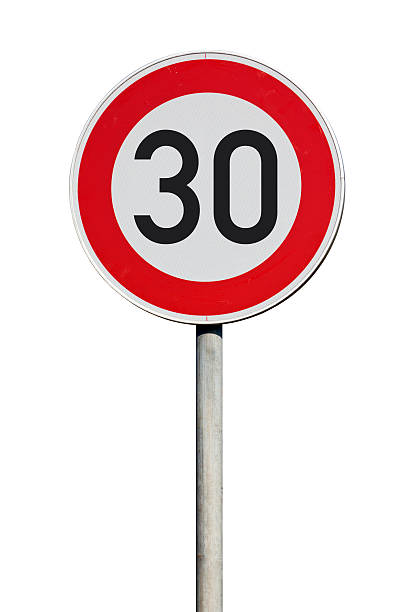 Speed limit 30 kilometers traffic sign isolated Traffic sign speed limit 30 kilometers per hour kilometer photos stock pictures, royalty-free photos & images