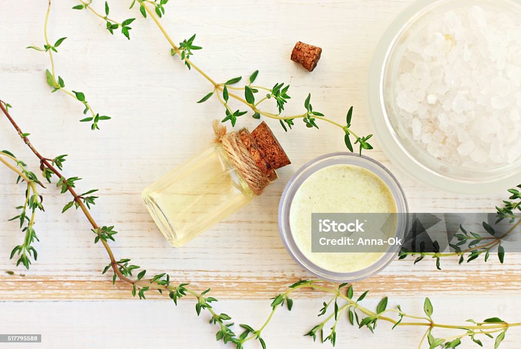Thyme aroma oil, facial cream, sea salt. Fresh thyme herbs. Herbal remedies. Top view.  Thyme Stock Photo