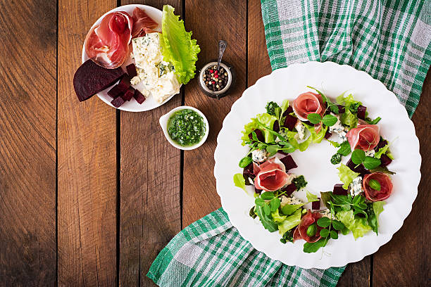 istock Salad with baked beet, blue cheese, ham and pesto. 517795750