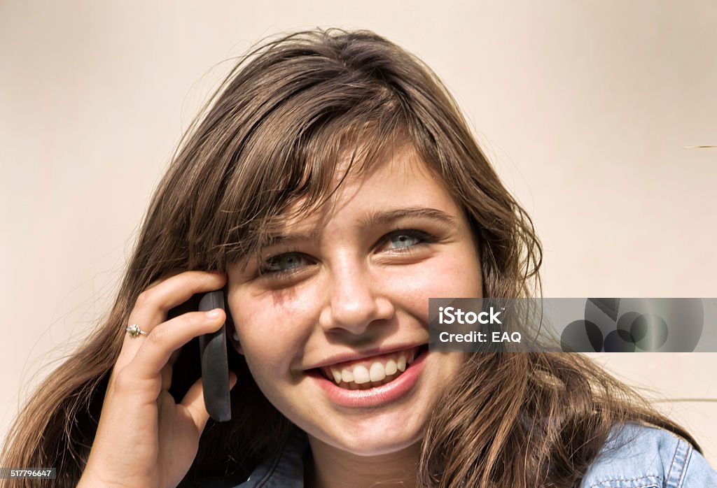 Teen with smartphone Teen in chatting with your smartphone. 14-15 Years Stock Photo