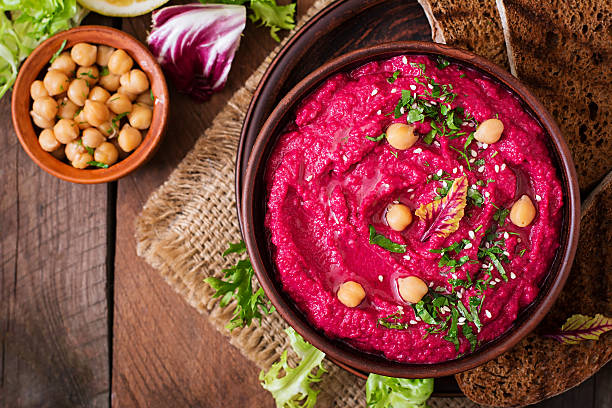 istock Roasted Beet Hummus with toast in a ceramic bowl 517797412