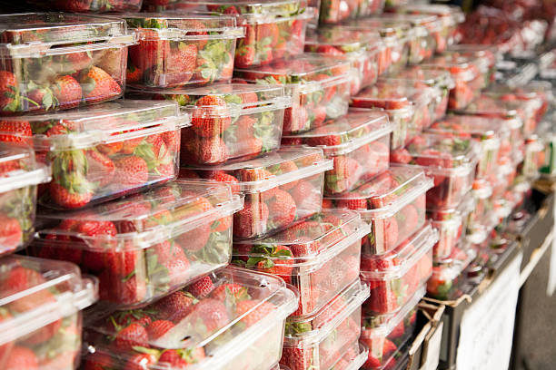 istock Large stack of strawberries in cartons 517797889