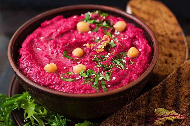 istock Roasted Beet Hummus with toast in a ceramic bowl 517798048