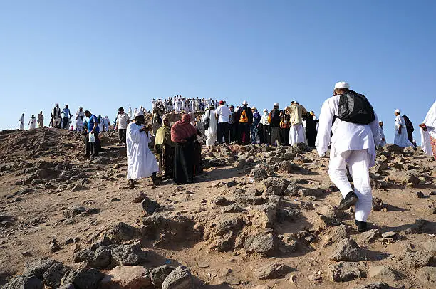 MEDINA, SAUDI ARABIA - SEPT 21 : pilgrims flocked hiking uphill of Jabal Uhud in September 21, 2013 in Medina, Saudi Arabia. Jabal Uhud is one of historical place in Islamic history.