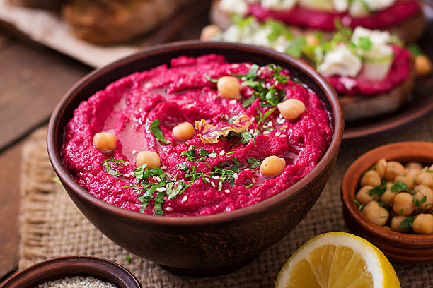 istock Roasted Beet Hummus with toast in a ceramic bowl 517798244