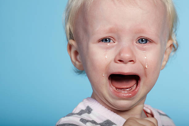 istock little cute child with tears on face 517798718